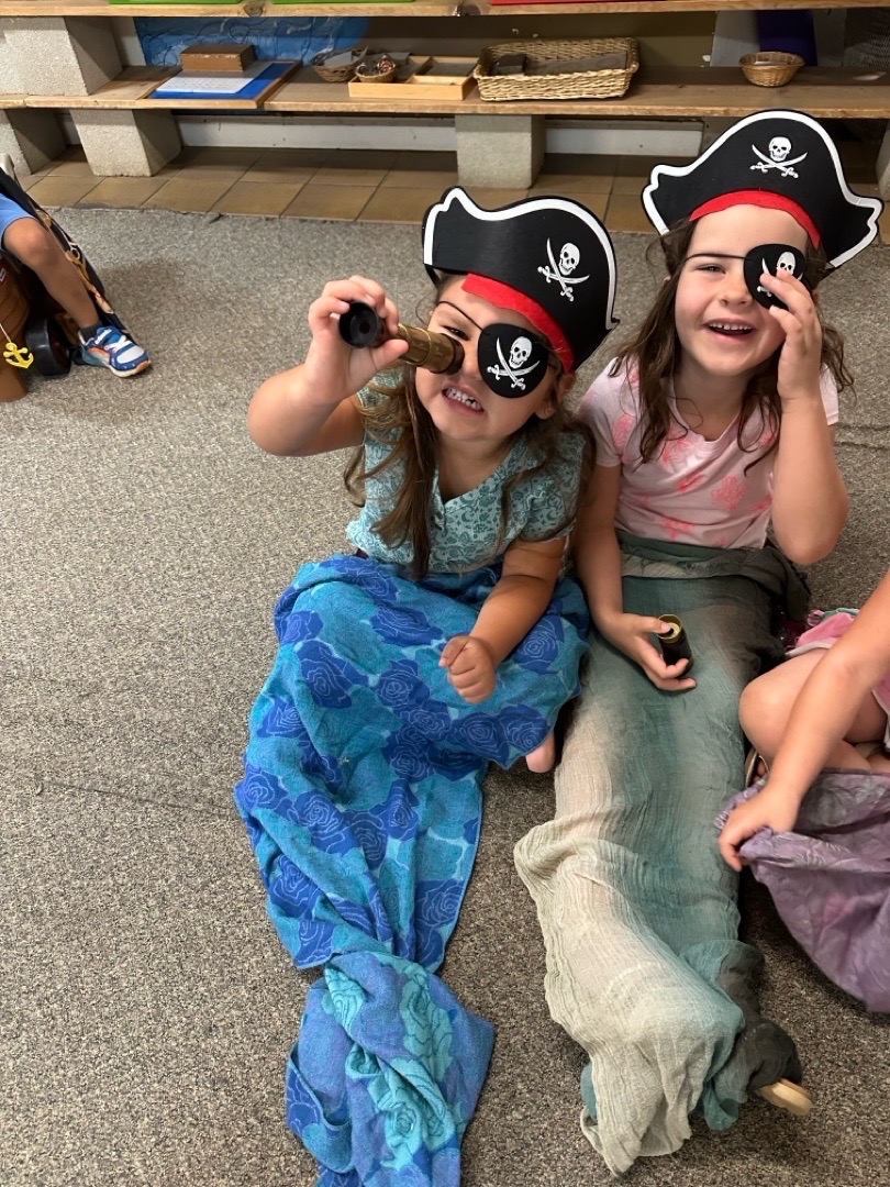 Two children dressed as pirates and mermaids during a themed activity at Mother Lode Mountain Tots.